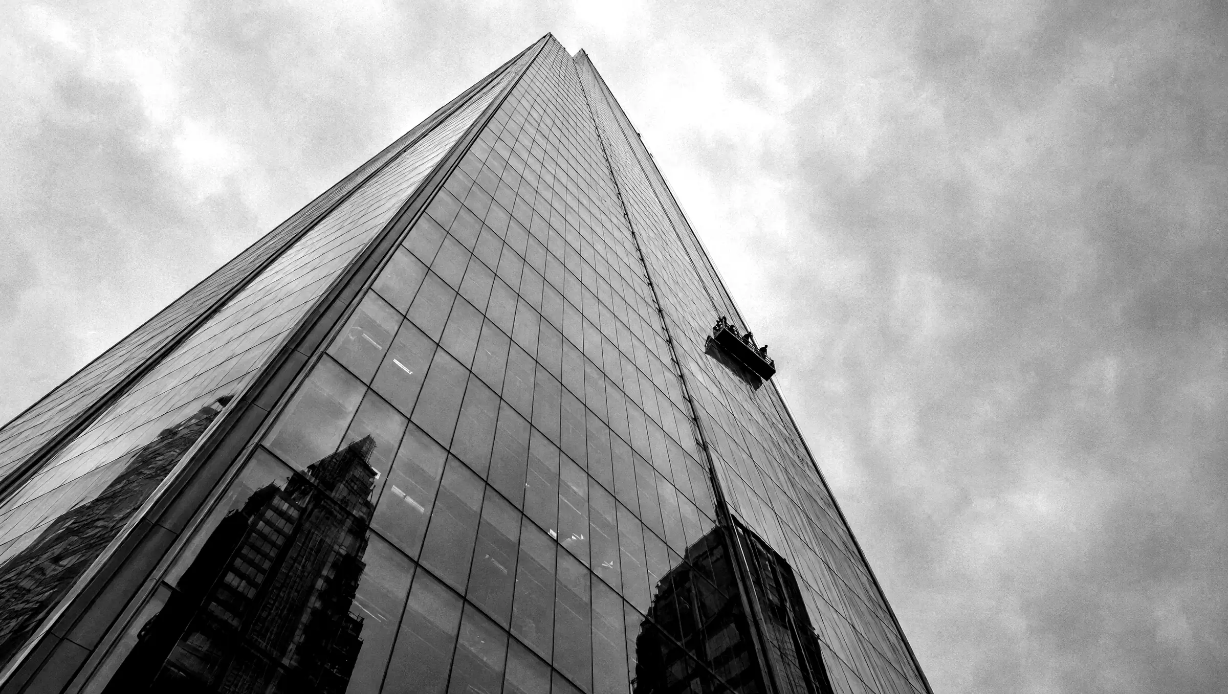 Looking up at a glass office tower in London